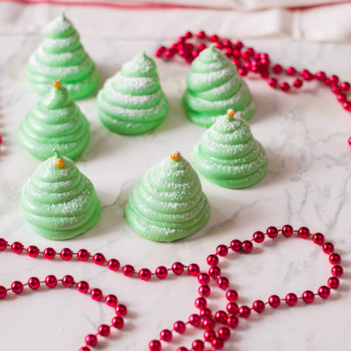 These Christmas Tree Meringue Cookies are a real stunner - and will complete any holiday dessert table! They’re unique and eye-catching. Your guests will surely love these sweet treats!